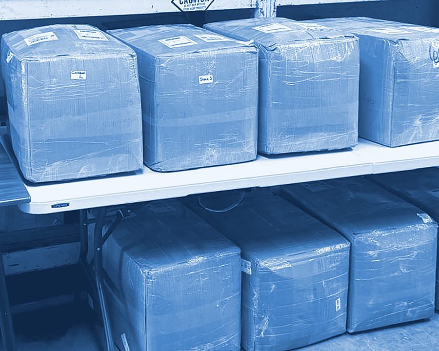 Shrink-wrapped cartons staged for shipping
